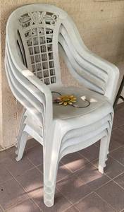 lot 277 image: Lot of 4 plastic patio chairs as shown. (Your bid x 4)