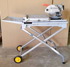 lot 1 image: DIAMONDBACK 7 WET TILE SAW WITH SLIDING TABLE PLUS FOLDING STAND WITH WHEELS AS SHOWN.