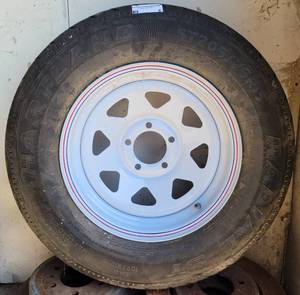 lot 8 image: TRAILER TIRE AS SHOWN. SEE PICTURES.
