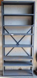 lot 9 image: METAL SHELF UNIT AS SHOWN. MEASURES APPROX. 36 W x 12 D x 85 H. SHELF IS BOLTED TO THE WALL. BUYER MUST BRING TOOLS FOR PROPER REMOMAL
