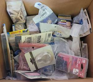 lot 61 image: MIXED LOT INCLUDING STAPLES, FLATHEAD PLUGS, EXTENSION SPRINGS, CLEAR BUMPERS AND MORE AS SHOWN.
