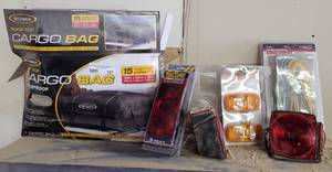 lot 127 image: LOT OF ASSORTED ITEMS INCLUDING CARGO BAG, WATERPROOF TAIL LIGHT AND MORE AS SHOWN.