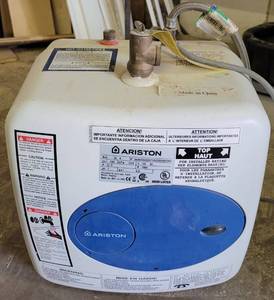 lot 138 image: ARISTON MINI-TANK WATER HEATER MODEL GL-4 AS SHOWN.