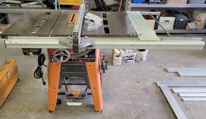 lot 189 image: RIDGID TS3650 13 AMP 10 INCH PROFESSIONAL CAST IRON TABLE SAW AS SHOWN. CHECK IT OUT