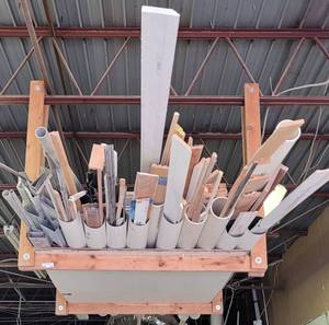 lot 191 image: SHOP-MADE CEILING MOUNTED RACK WITH ASSORTED PIPES AND TRIM AS SHOWN. BUYER MUST BRING TOOLS FOR PROPER REMOVAL.