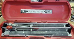 lot 208 image: RUBI TOOLS PROFESSIONAL TILE CUTTER WITH STORAGECARRYING CASE AS SHOWN.