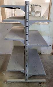 lot 256 image: COMMERCIAL DOUBLE SIDED SHELVINGDISPLAY UNIT ON WHEELS AS SHOWN. APPROX. 50 L x 32 W x 61.5 H.