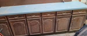 lot 283 image: CABINETS WITH COUNTER TOP IN STYLE, COLOR, AND CONDITION SHOWN. CONTENTS INCLUDED. APPROX. 106.5 L x 24 D x 36 H.