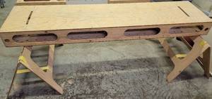 lot 345 image: SHOP MADE WORKTABLE SITTING ON PAIR OF SAWHORSES AS SHOWN. TABLE APPROX. 96 L x 24 W x 8 H.
