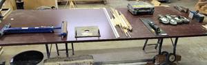 lot 401 image: LARGE SIZE CONFERENCE TABLE IN STYLE, COLOR SHOWN. THIS TABLE IS SITTING ON METAL STANDS BUT COMES WITH ORIGINAL LEGS. APPROX. 121 L x 48 W x 31 H.