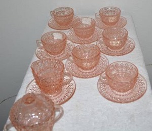 lot 250 image: Holiday Depression Glass Tea Set 7 Place Settings of Cups and Saucers Plus CreamSugar Dishes