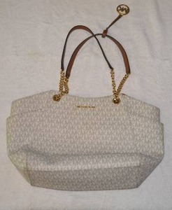 lot 55 image: Michael Kors with Gold Chain and Brown Leather Straps, Tag says made in Myanmar,  Please Preview