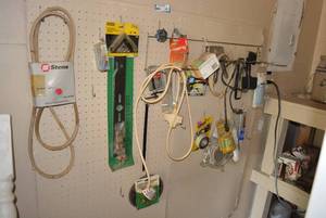 lot 101 image: Contents on Wall Stanley 3 Corner Bracket, Stens Belts 138256 for Lawn Mower, Tub & Tile Sealant, Staple Gun and More