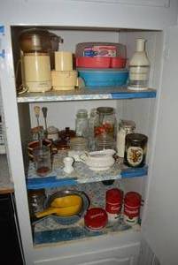 lot 9 image: Contents of Cabinet Campbells Soup Thermoses, Vintage Food Chopper, Glass Cannister Set and More