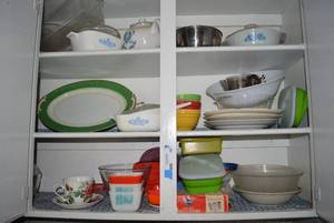 lot 10 image: Contents of Cabinet Corningware Dishes, Refrigerator Glass, fukagawa arita greengold rim platter and More