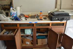 lot 132 image: Contents on Counter Bleach, Cell Phones, Briefcase and More, see pictures