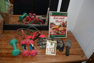 lot 189 image: Small Dumbbells, Stretchy Bands, Garden Gloves and Spade, and Uopened Eat and Heal Pack