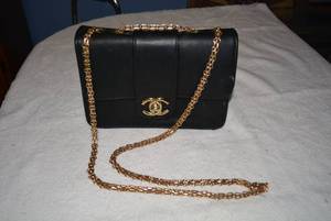 lot 51 image: CC Purse With Gold Strap with Red Interior, Tag says made in China, Please Preview