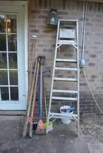 lot 304 image: Aluminum Ladder and Garden Tools and Planter