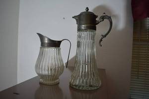 lot 236 image: Vintage Cut Glass Water Carafe with Ice Chiller and Pitcher, Both have Silver Plate Rims and Handles