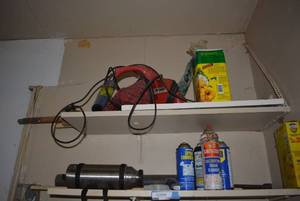 lot 135 image: Contents of Shelf Stainless Steel Thermos, Garden Disease Control, Wheeled Trimmer Replacement Line