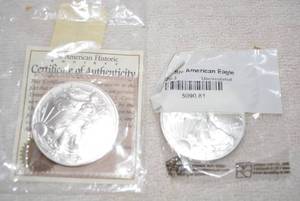 lot 444 image: 2005 Silver One Dollar Coin with Certificate and 2003 Uncirculated Silver One Dollar Coin