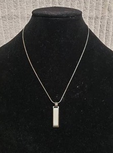 lot 554 image: Signed,boxed Lia Sophia (1986-2014) Share The Love Of Jewelry enamel black & white pendant on a 18L chain