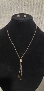 lot 556 image: Signed,boxed Lia Sophia (1986-2014) Share The Love Of Jewelry gold tone and rhinestone slide pendant necklace w matching poststud earrings. 26L