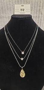 lot 561 image: (3) Lia Sophia (1986-2014) Share The Love Of Jewelry silver tone necklaces w rhinestones and enamel. Longest 22L chain with enamel pendant is marked. Others are 22 w magnetic clasp and 18L. Also includes a pair of poststud earrings.