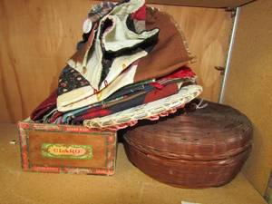 lot 97 image: brown basket full  of fabric
