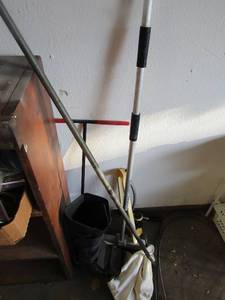 lot 102 image: garden sprinkler, ship broom T post foot boot