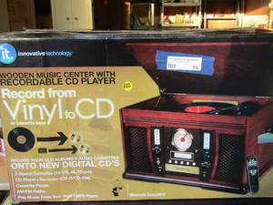 lot 19 image: Music center with recordable CDcassette IT brand remote included 3 speed turntable AMFM radio all paperwork included