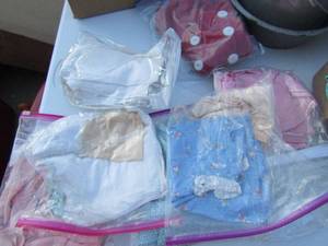 lot 24 image: Large lot of Vintage Baby  dresses and Red Car coat