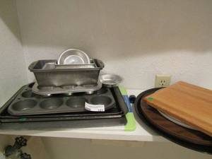 lot 121 image: Muffin pans, bread pans, cookie sheets cutting board and more