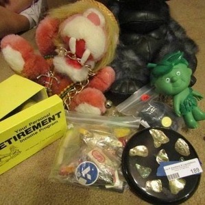 lot 189 image: Jolly green giant, bag of key chains, RETIREMENT KIT,  Pink lion and more