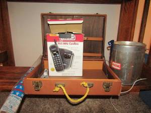 lot 375 image: LARGE CAN WITH MATCHES, BRIEFCASE, PHONE, USA FLAG