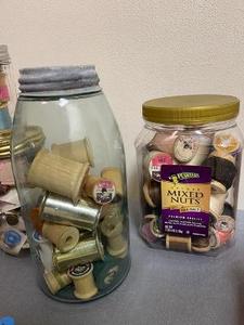 lot 61 image: 2 JARS WITH SPOOLS OF THREAD