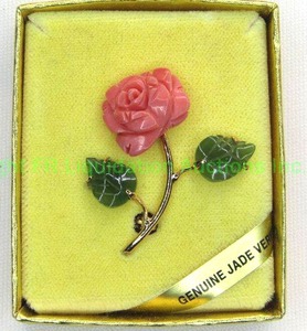 lot 39 image: Carved Jade and Angel Skin Coral