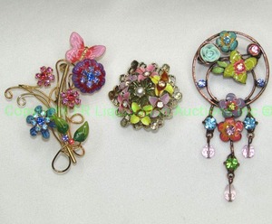 lot 61 image: Enamel, rhinestone and pearl