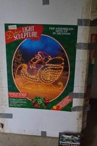 lot 21 image: Santa in Sleigh Light Sculpture and Icicle Lights