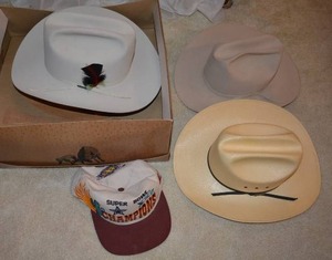 lot 168 image: Cowboy Hats Size 7 and Super Bowl Cap Resistol and Larry Mahans Brands