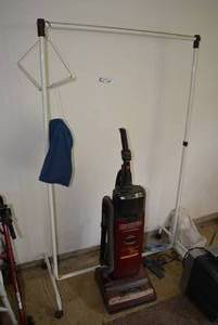 lot 43 image: Hoover Self Propelled Vacuum Model U6323-930 and Rolling Metal Clothes Rack and Clothes Pins