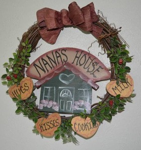lot 98 image: 6 Wall Decorations, including painted saw, wreaths welcome and door chime see all pictures