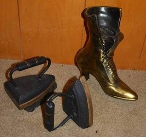 lot 106 image: Antique Cast Iron Sad Irons and Trivet Plus Brass Boot Vase