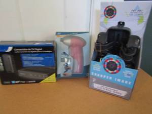 lot 17 image: NIB TV converter box, 6V Battery operated screwdriver (new) sharper image clip N roll skates