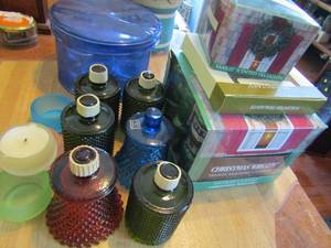 lot 25 image: 6 color glass candle holders, box of christmas candles  Yankee tea candles and assorted holders
