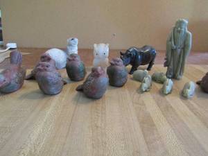 lot 29 image: Decor lot- Ferret, marble male statue 5 mini rabbits 7 birds marble owl and rhino