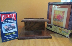 lot 68 image: Automatic card shuffler and new framed art with broken wooden stand