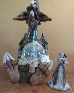 lot 71 image: 14 oil burning dragon and 5 La Vic Tine lady