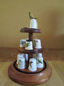 lot 84 image: Dome covered display with 3 tiers  contains thimbles  of hummingbirds all porcelain except one brass